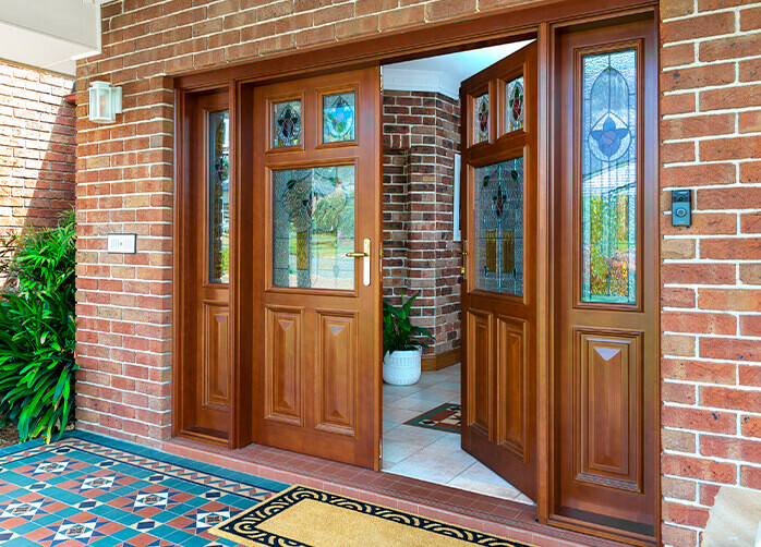 https://www.doorsplus.com.au/wp-content/uploads/2021/04/Doors-Plus-External-Entrance-Solid-timber-Pyrmont-Stained-in-Dark-Maple-Heritage-glass-double-hinged-door-with-double-side-panel.jpg