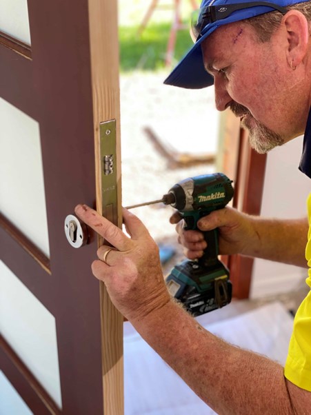 Doors Plus - Installer installing lock